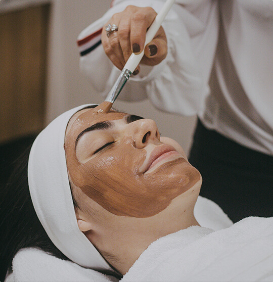 A female having a facial